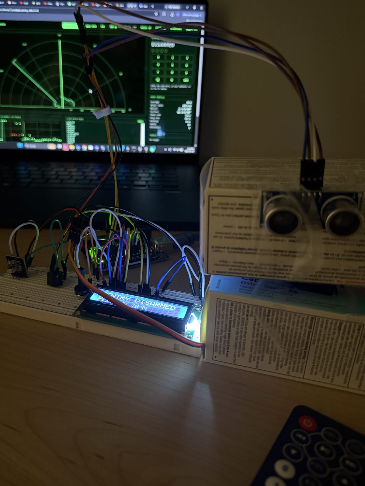 Disarmed and waiting, with the IR remote and the live dashboard.